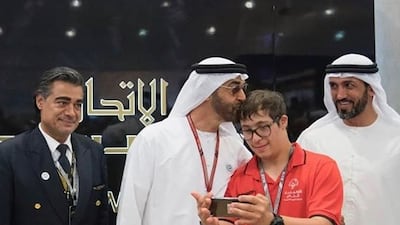 Sheikh Mohamed with UAE Special Olympic swimmer Omar Al Shami. Photo: Omar Al Shami family