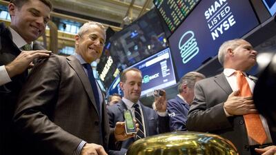 Shake Shack founder Danny Meyer rings a ceremonial bell during the company’s trading debut on the New York Stock Exchange. Brendan McDermid / Reuters