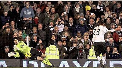 Petr Cech of Chelsea saves a penalty from Clint Dempsey at Craven Cottage.