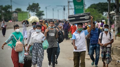 People travel home from the capital Dhaka, after Bangladesh's government imposed a lockdown to curb the spread of Covid-19 coronavirus.