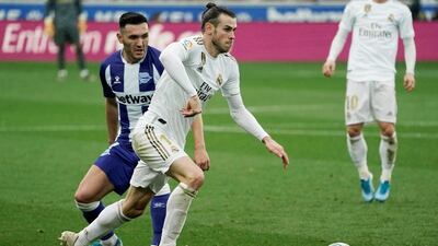 Alaves' Lucas Perez in action with Real Madrid's Gareth Bale. Reuters
