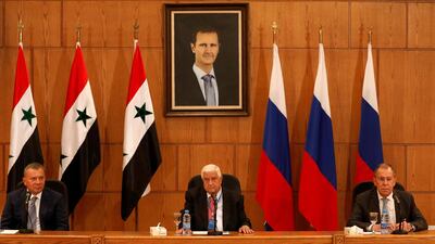 Russian Deputy Prime Minister Yuri Borisov, Foreign Minister Sergei Lavrov, and Syria's Foreign Minister Walid Muallem attend a press conference in Damascus, Syria. Reuters