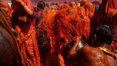 Indian revellers take part in Huranga at The Dauji Temple in Mathura, about 100km south of New Delhi. Huranga is a game played between men and women a day after Holi. Chandan Khanna / AFP Photo
