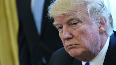 US President Donald Trump pauses as he speaks from the Oval Office of the White House in Washington, DC, on March 24, 2017. Trump on Friday asked US Speaker of the House Paul Ryan to withdraw the embattled Republican health care bill, moments before a vote, signaling a major political defeat for the US president. / AFP / MANDEL NGAN