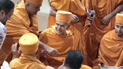 His Holiness Mahant Swami Maharaj greets others at the ceremony.