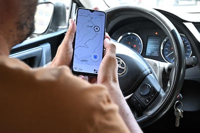 Lebanese Uber driver Hussein Khalil shows his GPS-jammed geolocation on the Uber app. AFP
