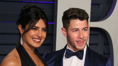 Priyanka Chopra in Elie Saab and Nick Jonas arrive at the 2019 Vanity Fair Oscar Party. AFP