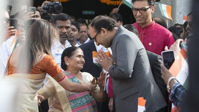 Indian families wave the flag as they celebrate independence day