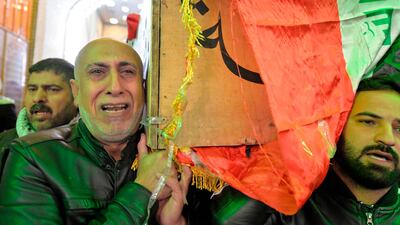 Iraqi mourners carry the coffin of a victim who was killed in a twin suicide bombing in central Baghdad, during a funeral in the holy city of Najaf, Iraq. AFP