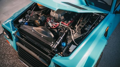 It has a V12 engine and five-speed manual gearbox with a dogleg first gear