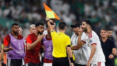 UAE players complain to the assistant referee. Reuters