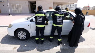 A rescue operation under way after a child was locked in a car in Dubai. Chris Whiteoak / The National