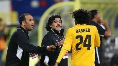 Al Wasl coach Diego Maradona on the touchline with Rashed Essa, one of the goalscorers.