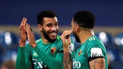 Watford's Etienne Capoue celebrates with Troy Deeney at the end of their FA Cup match against QPR. David Klein / Reuters