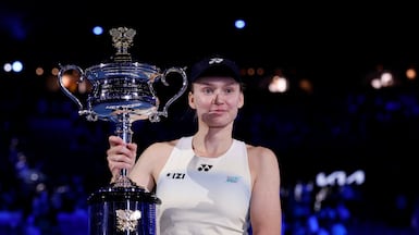 Elena Rybakina of Kazakhstan poses with the Daphne Akhurst Memorial Cup after her victory in the Australian Open final against Aryna Sabalenka. Getty Images