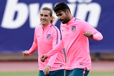 Diego Costa, right, is back at Atletico Madrid and is training, but will not be eligible for selection until January. Javier Soriano / AFP