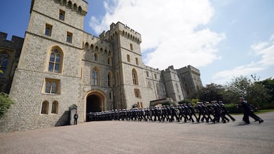 Navy personnel enter the quadrangle. AP