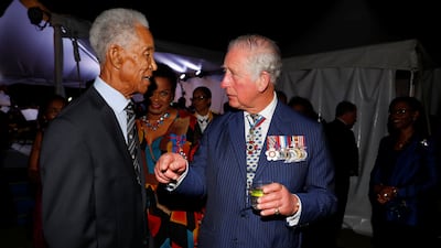Speaking with then Prince Charles, Prince of Wales during a reception at the Prime Minister's residence during the West Indies' Caribbean tour on March 19, 2019 in Bridgetown, Barbados. Getty Images