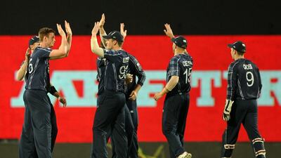 Scotland’s Alasdair Evans (L) celebrates with teammates after his dismissal of Afghanistan’s Noor Ali Zadran during the ICC World T20 cricket tournament match between Afghanistan and Scotland at The Vidarbha Cricket Association Stadium in Nagpur on March 8, 2016. AFP