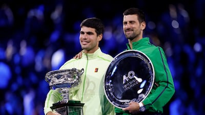 Carlos Alcaraz alongside runner-up Novak Djokovic at Melbourne Park. Getty Images
