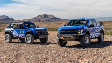 The Ford Bronco Raptor, left, and 3.5-litre F-150 Raptor. Ford could draw on its off-road expertise for the rumoured Mustang Baja. Photo: Ford