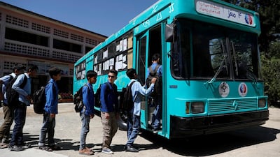 School boys board on a mobile library bus in Kabul, Afghanistan. All photos by Reuters