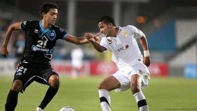ABU DHABI, UNITED ARAB EMIRATES - April 17, 2012 - Baniyas' Mohamed Jabeer races against Al Ittihad's Naif Hazazi for control of the ball during game action between Baniyas and Al Ittihad on Tuesday, April 17, 2012. ( DELORES JOHNSON / The National )