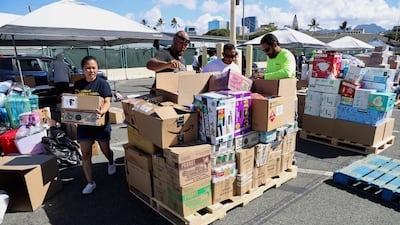 Hawaii stevedores and other volunteers prepare donations in Hawaii. Reuters