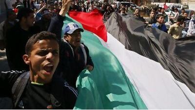 Palestinian demonstrators take part in a protest calling for Palestinian political unity between Gaza's Hamas rulers and the Fatah-dominated Palestinian Authority which rules from Ramallah. AFP PHOTO/SAID KHATIB Said Khatib / AFP Photo