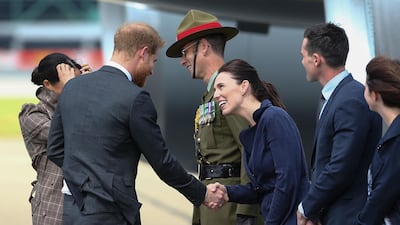 Prince Harry, Duke of Sussex and Meghan, Duchess of Sussex meet Prime Minister Jacinda Ardern as they arrive at the Wellington International Airport Military Terminal. Getty Images