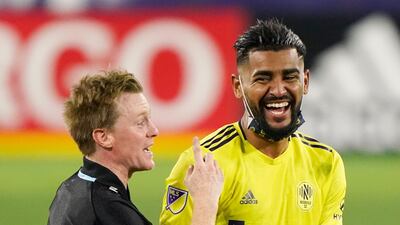 Nashville midfielders Dax McCarty, left, and Anibal Godoy leave the pitch. AP