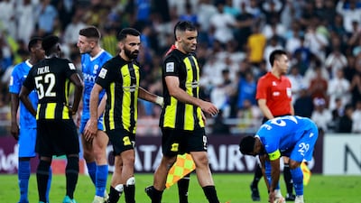 Al Ittihad's Abderrazak Hamdallah makes his way off the pitch after being shown a red card. Reuters