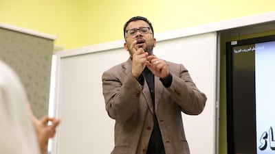 Wael Kamel, a sign-language interpreter at the Sharjah City for Humanitarian Services Organisation, wants to bridge the gap between the deaf and the rest of the community. Pawan Singh / The National