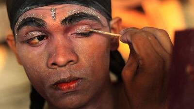 A Sri Lankan traditional dancer applies make up before Navam Perahera, a Buddhist pageant of elephants, dancers and drummers, in Colombo on February 15, 2014. Over 50 elephants are participating in a street parade for Gangaramaya temple’s annual Perahera festival, along with a nightly procession of traditional dancers, fire twirlers and traditional musicians. Dinuka Liyanawatte / Reuters
