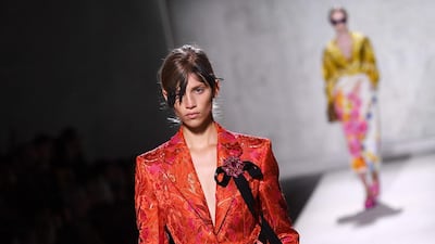 Head to toe jacquard in chartreuese and orange by Dries Van Noten and Christian Lacroix, for Spring-Summer 2020. AFP
