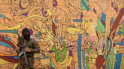 A soldier photographed during a campaign to clean up graffiti associated with the Mara Salvatrucha gang in Quezaltepeque, a town 15 km from San Salvador, in an operation to take back gang-controlled neighborhoods. The Salvatrucha (MS-13) and 18th Street gangs are the main cause of the escalation of violence plaguing El Salvador, where an estimated 60,000 people belong to gangs, 15,000 of them in prison. Marvin Recinos / AFP