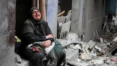 A woman weeps at the site of an Israeli air strike on houses at Shati refugee camp in Gaza city. Reuters