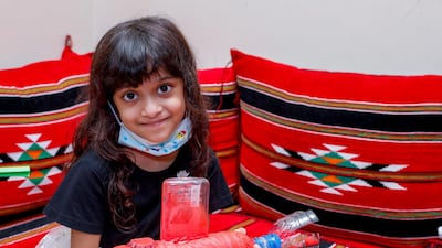 Six-year-old Meera shows off her artwork. Victor Besa /The National