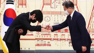 South Korean President Moon Jae-in greeting BTS member V at The Blue House in Seoul. EPA