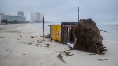 A lifeguard tower lies on its side after it was toppled over by Hurricane Delta in Cancun, Mexico. AP Photo