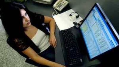 A Lebanese stock exchange employee works in Beirut. The country's businesses are hindered by poor internet connectivity.