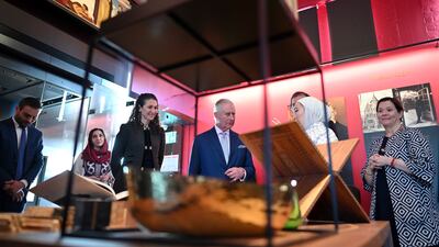 The monarch is shown a collection of artworks from Syria, Jordan and Afghanistan. Getty Images