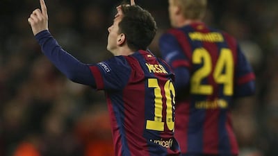 Barcelona's Lionel Messi celebrates scoring the first goal in Barca's 3-1 victory over Paris Saint-Germain on Wednesday night to win their Champions League group at the Camp Nou in Barcelona. Toni Albir / EPA