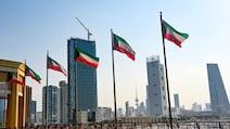 Kuwaiti national flags fly in Kuwait City. EPA