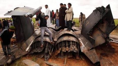 The wreckage of a US Air Force F-15E fighter jet after it crashed near Benghazi yesterday. The fighter jet crashed in Libya after apparent mechanical failure. Its crew escaped safely.
