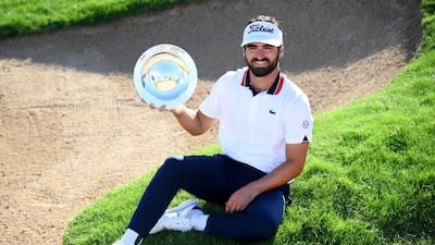 Antoine Rozner of France with the winners trophy in Dubai. Getty