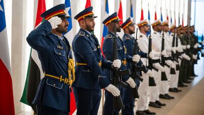 An Armed Forces honour guard welcomes Mr Boric