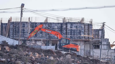 An Israeli bulldozer near the Israeli settlement of Migdalim, close to the Palestinian village of Qusra, south of the city of Nablus in the occupied West Bank, on September 6. AFP