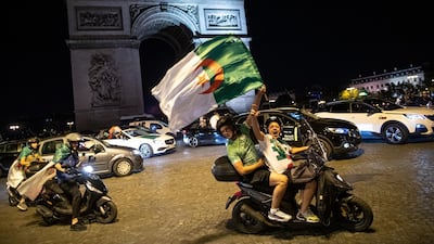 Algeria supporters celebrate on the Champs-Elysees after their Africa Cup of Nations title win last Friday. Ian Langsdon / EPA