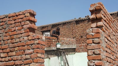 A builder at a construction site in Indiranagar. The World Bank says up to 380 million people in India are employed in jobs exposed to the heat